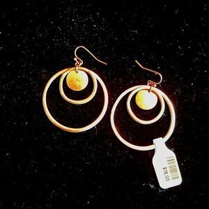 Pair of gold tone hoop earrings. Costume jewelry.
